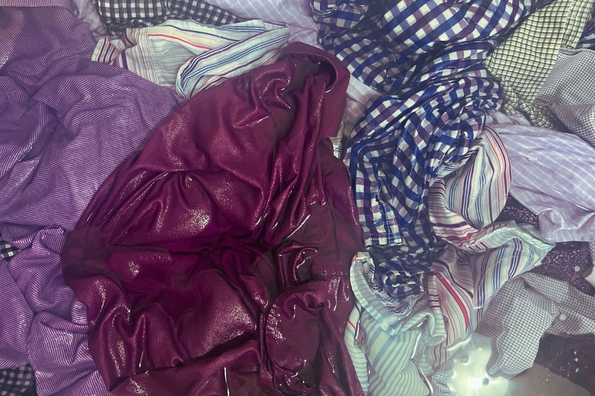 Men's dress shirts soaking in hot water and vinegar to neutralize odor