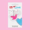 THRD-Bird (1) Prym Love Birdy Needle Threader in pink. Bird-shaped hand sewing tool with long beak for threading needles, integrated thread cutter, and protective cap.